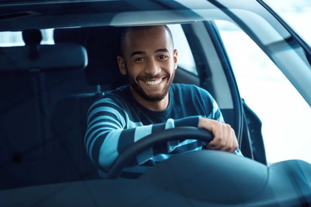 smiling man driving